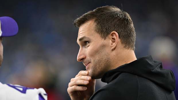 Jan 7, 2024; Detroit, Michigan, USA; Minnesota Vikings quarterback Kirk Cousins (8) talks with teammates prior to their game against the Detroit Lions at Ford Field.